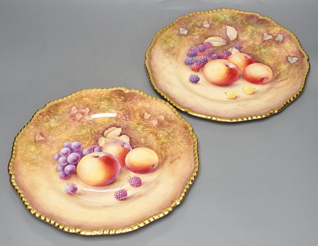 A pair of Royal Worcester fruit painted dinner plates, post war, by J. Reed, 27cm diameter